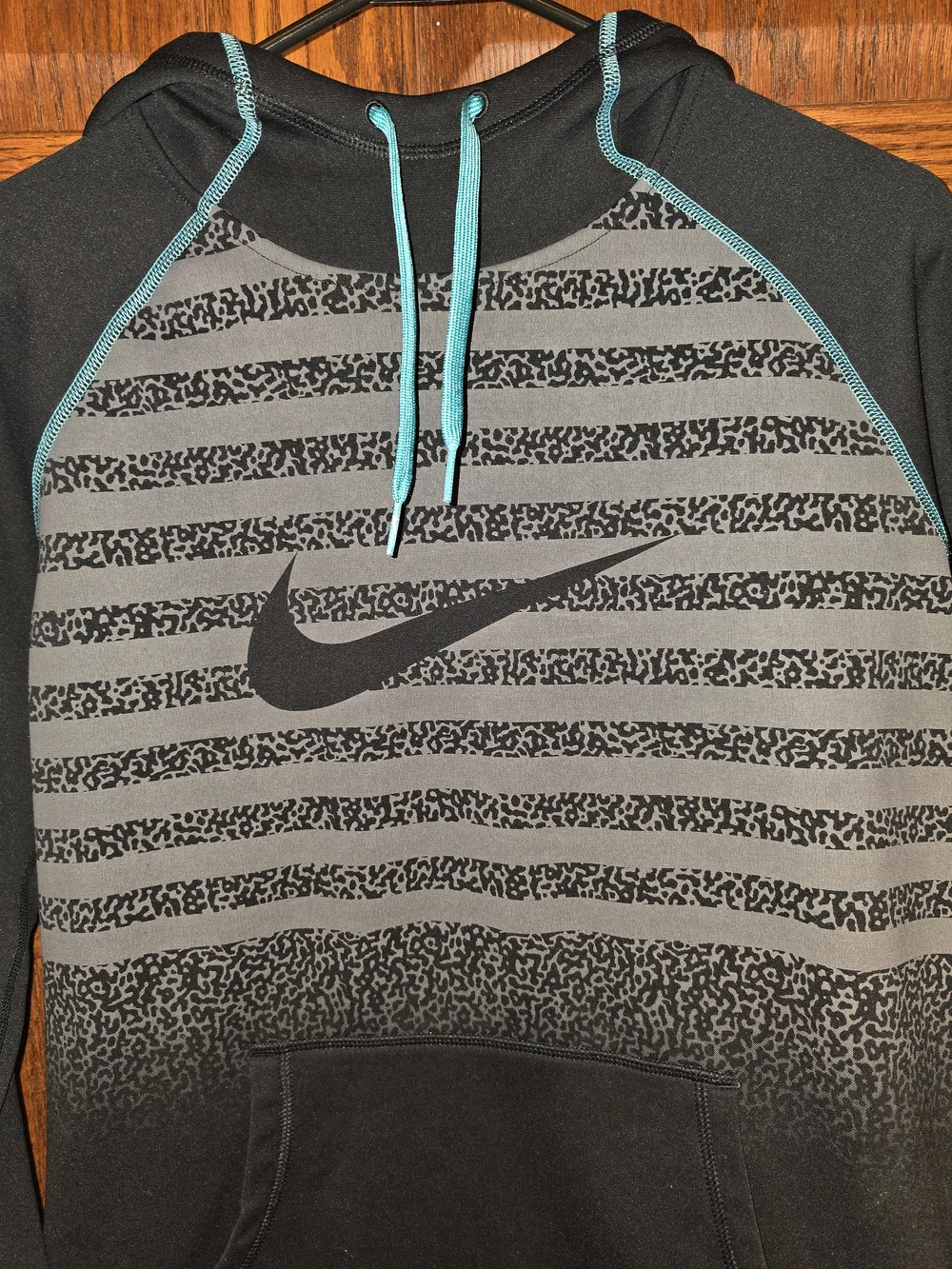 Nike Black Hoodie with Teal Accents and Striped Front